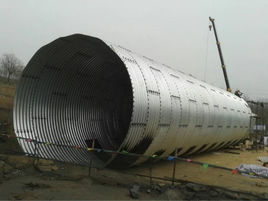 高填土时钢波纹管涵与拱涵的比较